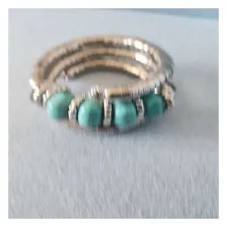 Coil bracelet with turquoise stones
